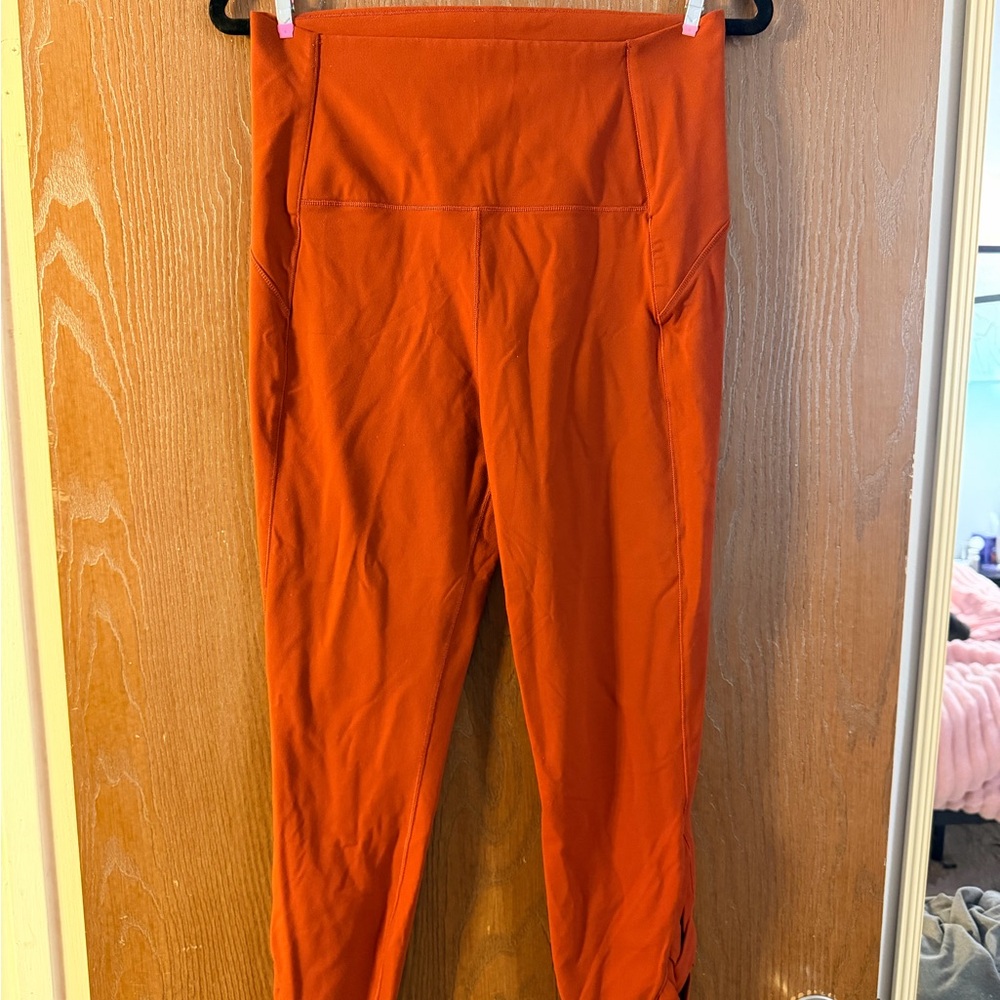 Orange Women’s Large Calla High-Waisted Leggings with braided leg detail